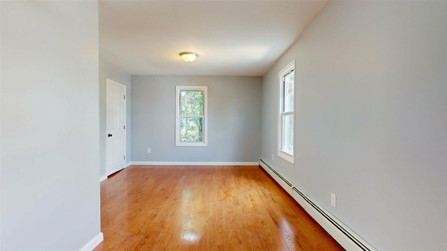 74 Gladstone Ave, Walden, NY 12586 - empty room with a baseboard radiator, plenty of natural light, light wood-style floors, and baseboards