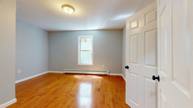 74 Gladstone Ave, Walden, NY 12586 - empty room featuring baseboard heating, light wood-style floors, and baseboards