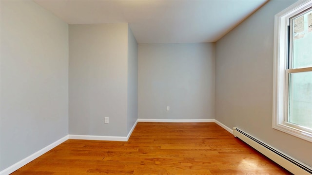 74 Gladstone Ave, Walden, NY 12586 - bonus room with baseboard heating, healthy amount of natural light, light wood-style flooring, and baseboards
