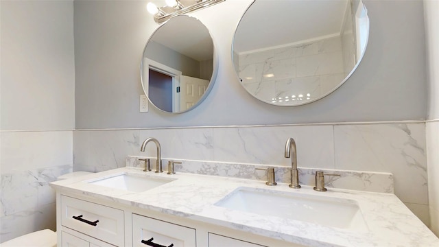 74 Gladstone Ave, Walden, NY 12586 - bathroom with tile walls, double vanity, and toilet