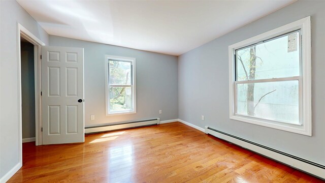 74 Gladstone Ave, Walden, NY 12586 - empty room featuring baseboard heating, light wood finished floors, and baseboards