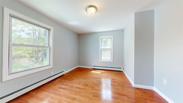 74 Gladstone Ave, Walden, NY 12586 - spare room featuring baseboard heating, light wood-type flooring, and baseboards