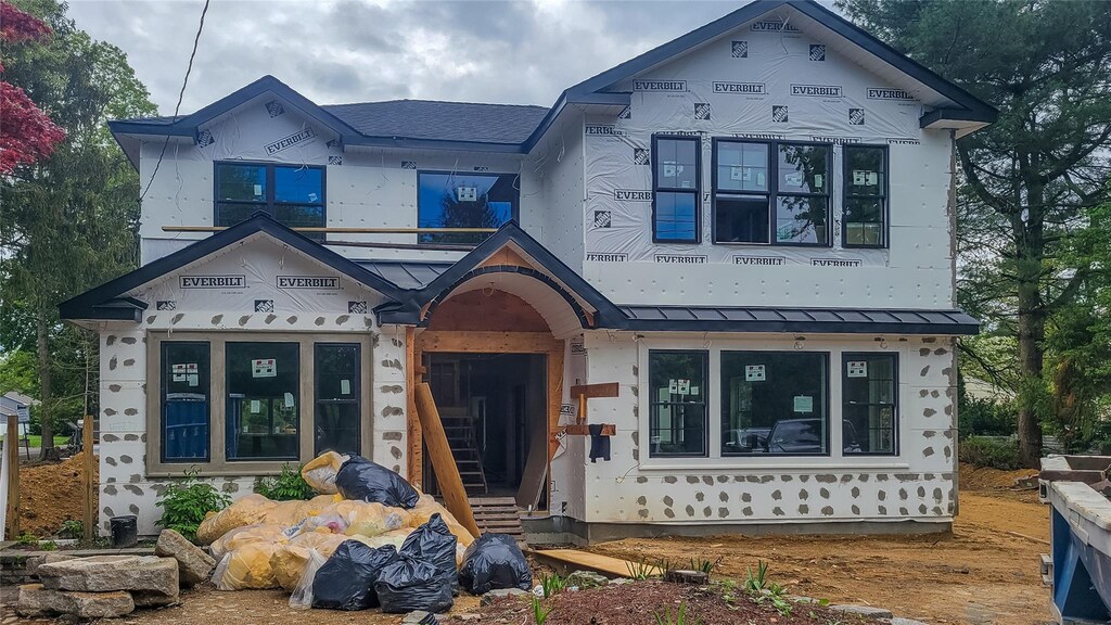 1130 Carlls Straight Path, Dix Hills, NY 11746 - property under construction with a standing seam roof, metal roof, and entry steps
