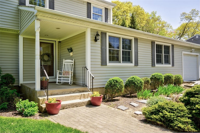 view of exterior entry with a garage