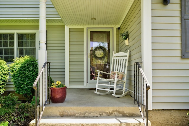 doorway to property featuring covered porch