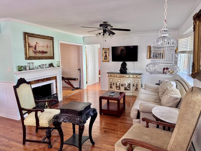 980 Siems Ct, North Bellmore, NY 11710 - living room with ceiling fan, crown molding, light wood finished floors, and a high end fireplace