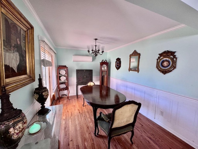 980 Siems Ct, North Bellmore, NY 11710 - dining area with a chandelier, a wall mounted air conditioner, wood finished floors, ornamental molding, and wainscoting