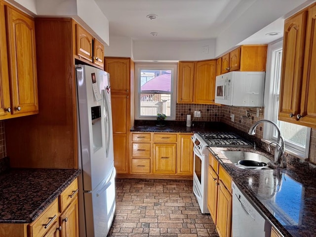980 Siems Ct, North Bellmore, NY 11710 - kitchen with white appliances, a sink, decorative backsplash, and dark stone counters
