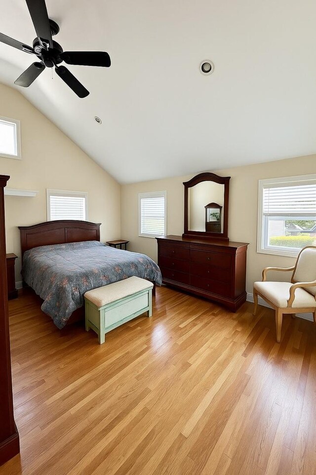 980 Siems Ct, North Bellmore, NY 11710 - bedroom featuring light wood finished floors, lofted ceiling, multiple windows, and ceiling fan