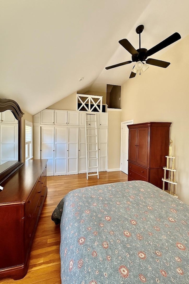 980 Siems Ct, North Bellmore, NY 11710 - bedroom featuring wood finished floors, lofted ceiling, and a ceiling fan