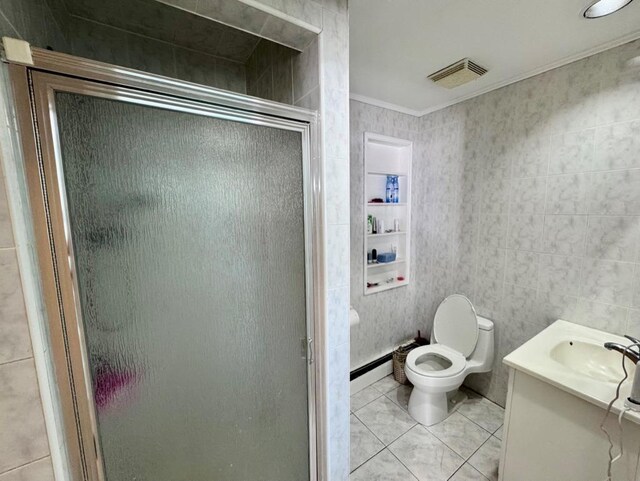 980 Siems Ct, North Bellmore, NY 11710 - full bath with a stall shower, ornamental molding, vanity, toilet, and tile patterned floors
