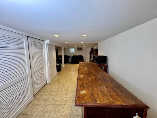 980 Siems Ct, North Bellmore, NY 11710 - kitchen featuring light tile patterned flooring, recessed lighting, a wall unit AC, and dark countertops