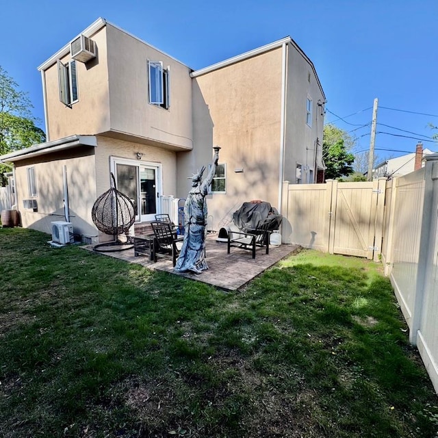 980 Siems Ct, North Bellmore, NY 11710 - back of house featuring a patio area, stucco siding, and a gate