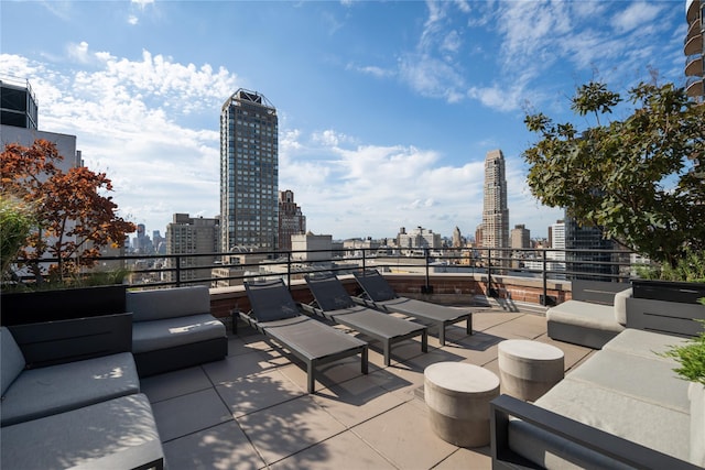 view of patio with a view of skyline and outdoor lounge area