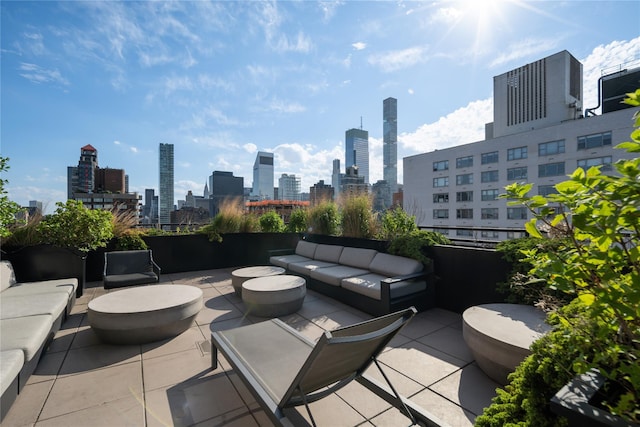 view of patio featuring a skyline view and an outdoor living space