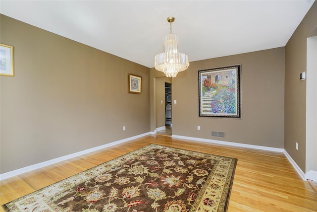 415 Spotswood Englishtown Rd, Nj, NJ 08831 - dining area featuring a chandelier, light wood-style flooring, and baseboards