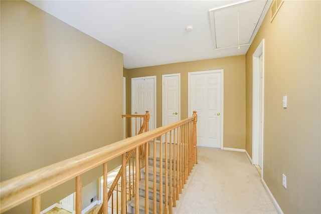 415 Spotswood Englishtown Rd, Nj, NJ 08831 - hall featuring attic access, an upstairs landing, baseboards, and light carpet