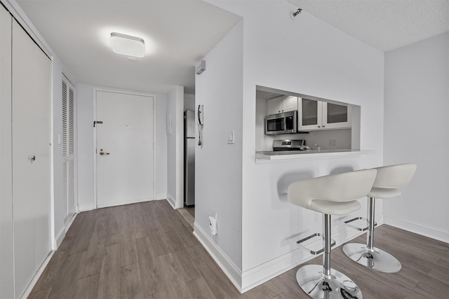 10 Stewart Pl Unit 4De, White Plains, NY 10603 - hall featuring baseboards and wood finished floors
