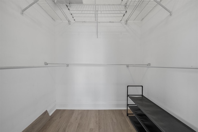 10 Stewart Pl Unit 4De, White Plains, NY 10603 - walk in closet featuring wood finished floors