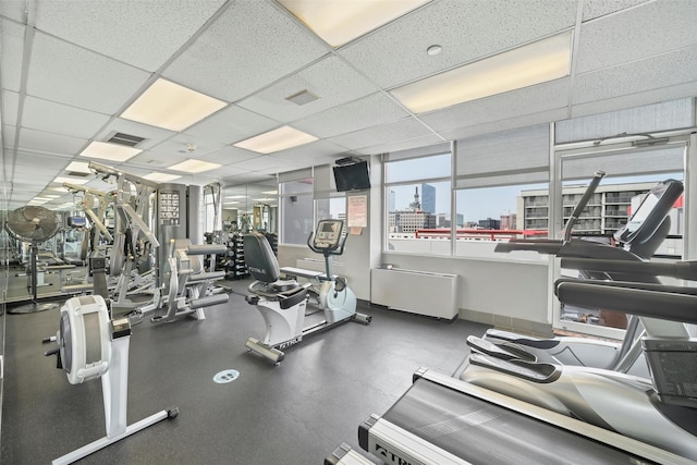 10 Stewart Pl Unit 4De, White Plains, NY 10603 - exercise room featuring a drop ceiling and baseboards
