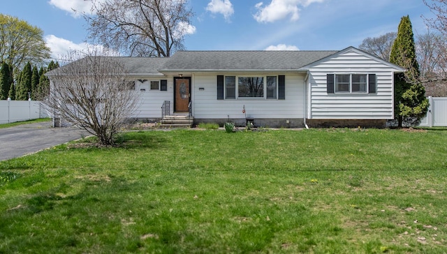 single story home featuring asphalt driveway