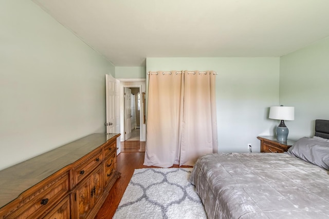 bedroom featuring dark wood-style floors