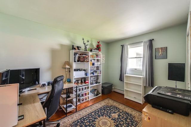 office with a baseboard heating unit and wood finished floors