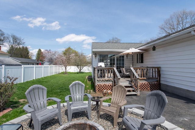 view of patio / terrace with an outdoor fire pit and a wooden deck