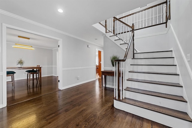 stairway featuring wood finished floors, crown molding, recessed lighting, and baseboards