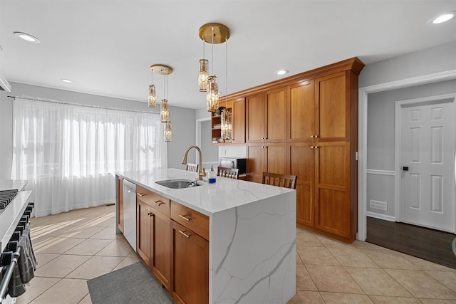 kitchen with a sink, light tile patterned flooring, brown cabinetry, stainless steel appliances, and recessed lighting