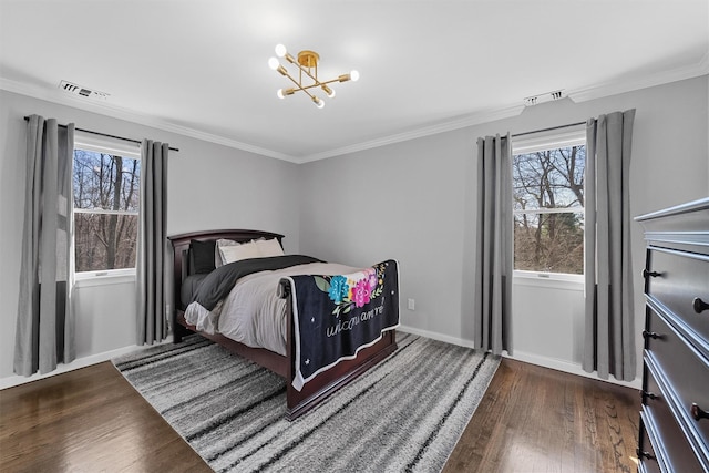 bedroom featuring wood finished floors, a chandelier, multiple windows, ornamental molding, and baseboards