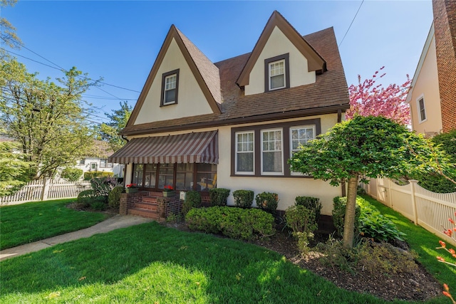 1875 Harte St, Baldwin, NY 11510 - tudor home with stucco siding and a shingled roof
