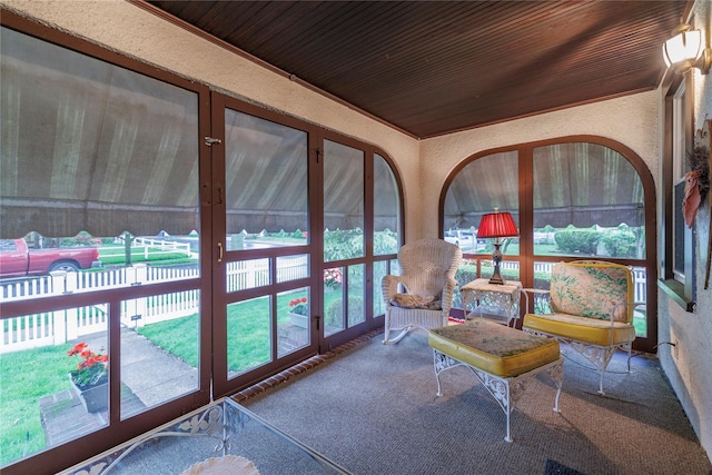 1875 Harte St, Baldwin, NY 11510 - sunroom / solarium featuring french doors, carpet flooring, wooden ceiling, and a textured wall