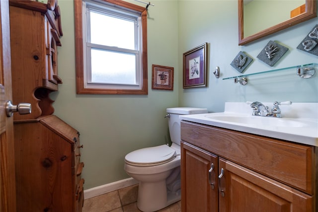 1875 Harte St, Baldwin, NY 11510 - half bathroom with toilet, tile patterned floors, baseboards, and vanity