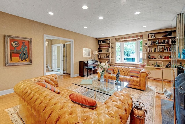 21 Hereford Rd, Great Neck, NY 11020 - living area featuring baseboards, wood finished floors, recessed lighting, and a textured ceiling