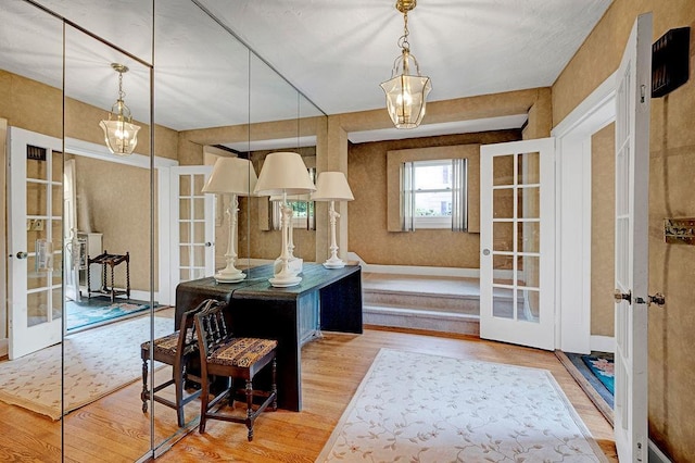 21 Hereford Rd, Great Neck, NY 11020 - kitchen with french doors, wood finished floors, and hanging light fixtures