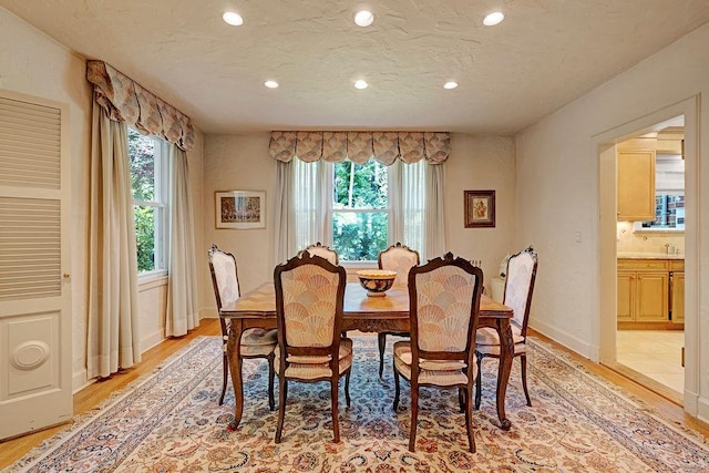 21 Hereford Rd, Great Neck, NY 11020 - dining room featuring light wood-style flooring, recessed lighting, and baseboards