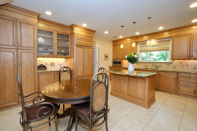 21 Hereford Rd, Great Neck, NY 11020 - kitchen with stainless steel microwave, a sink, decorative backsplash, a center island, and recessed lighting
