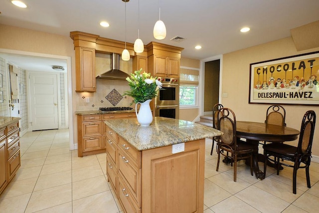 21 Hereford Rd, Great Neck, NY 11020 - kitchen featuring wall chimney range hood, appliances with stainless steel finishes, backsplash, light stone counters, and a center island