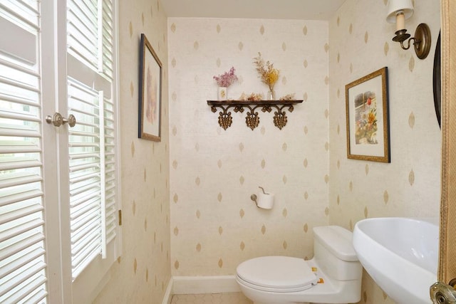 21 Hereford Rd, Great Neck, NY 11020 - bathroom featuring toilet, a sink, baseboards, tile patterned floors, and radiator