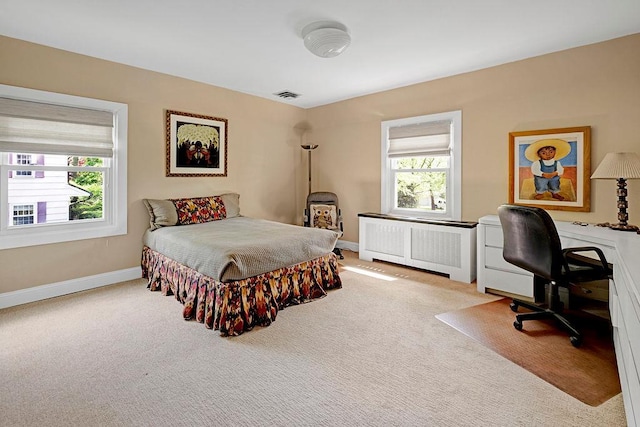 21 Hereford Rd, Great Neck, NY 11020 - carpeted bedroom with radiator, baseboards, and a desk