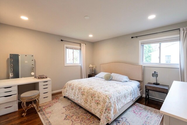 bedroom featuring dark wood finished floors, recessed lighting, and baseboards