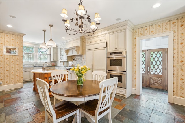 17 The Intervale, Roslyn Estates, NY 11576 - dining space with stone tile floors, wallpapered walls, crown molding, a chandelier, and recessed lighting
