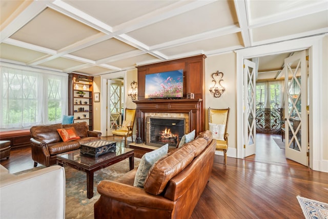17 The Intervale, Roslyn Estates, NY 11576 - living area with dark wood finished floors, a high end fireplace, coffered ceiling, beamed ceiling, and built in shelves