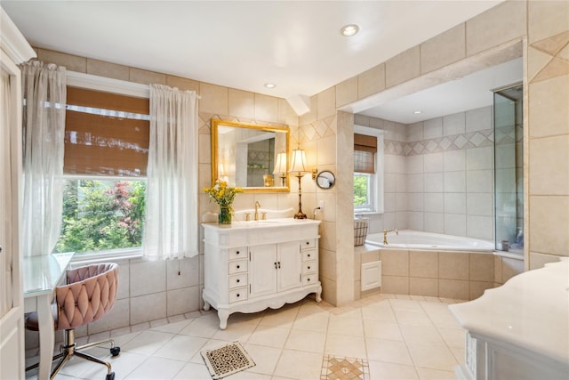 17 The Intervale, Roslyn Estates, NY 11576 - bathroom with tile patterned flooring, tile walls, a relaxing tiled tub, and vanity