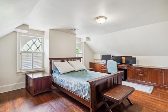 17 The Intervale, Roslyn Estates, NY 11576 - bedroom featuring vaulted ceiling, dark wood finished floors, baseboards, and an office area