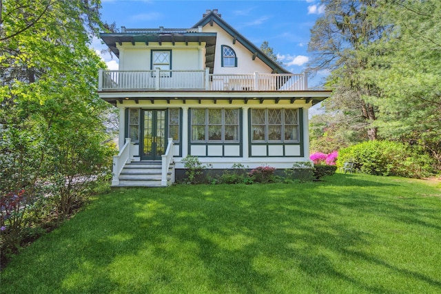 17 The Intervale, Roslyn Estates, NY 11576 - rear view of house featuring a balcony, french doors, a yard, stucco siding, and entry steps