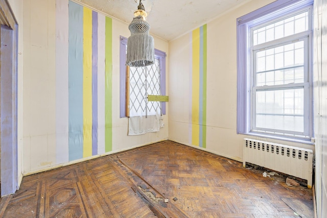 1410 Lincoln Pl, Brooklyn, NY 11213 - empty room featuring radiator heating unit and healthy amount of natural light