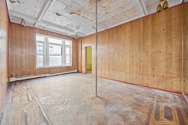 1410 Lincoln Pl, Brooklyn, NY 11213 - spare room featuring a baseboard heating unit, wooden walls, and coffered ceiling