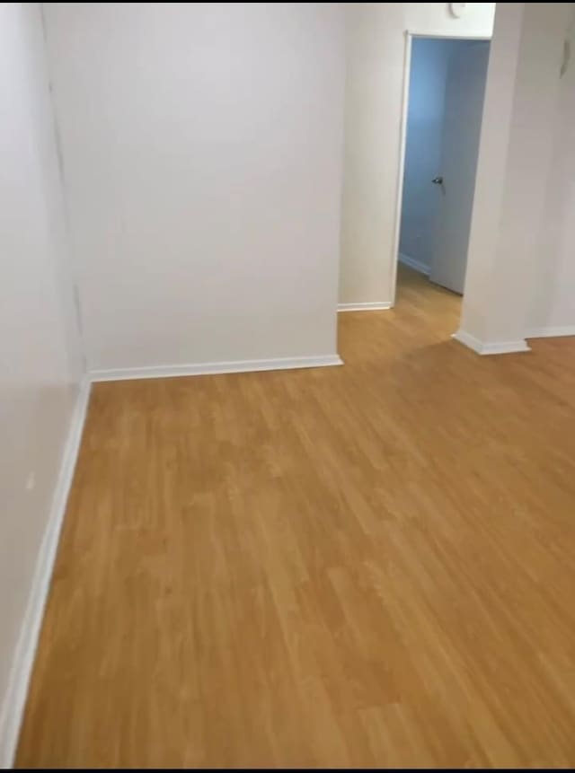 42-40 Bowne St Unit 3L, Flushing, NY 11355 - empty room featuring baseboards and light wood-style floors